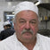 Portrait d’un chef à moustache dans sa cuisine
